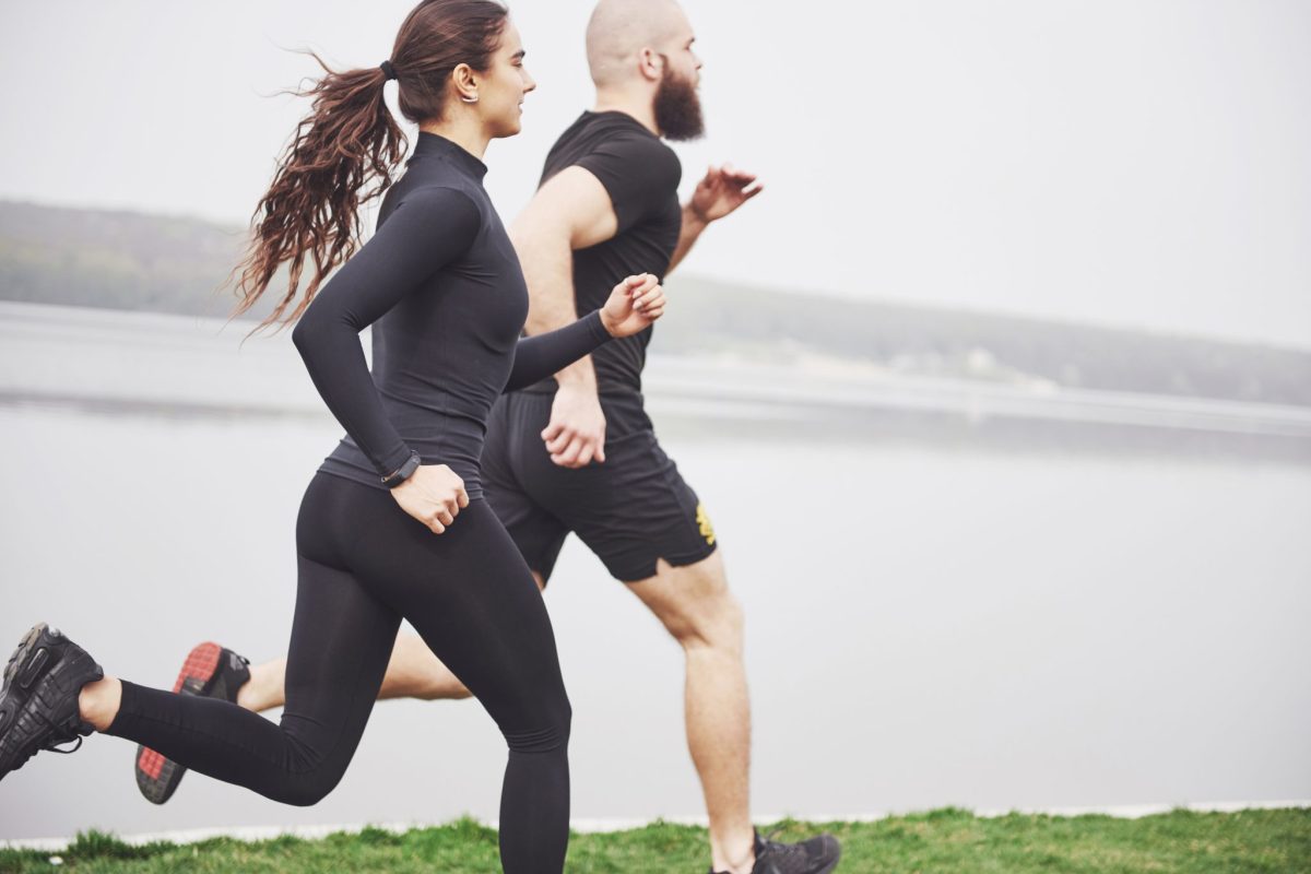 couple-jogging-and-running-outdoors-in-park-near-the-water-young-bearded-man-and-woman-exercising-together-in-morning-2048x1367